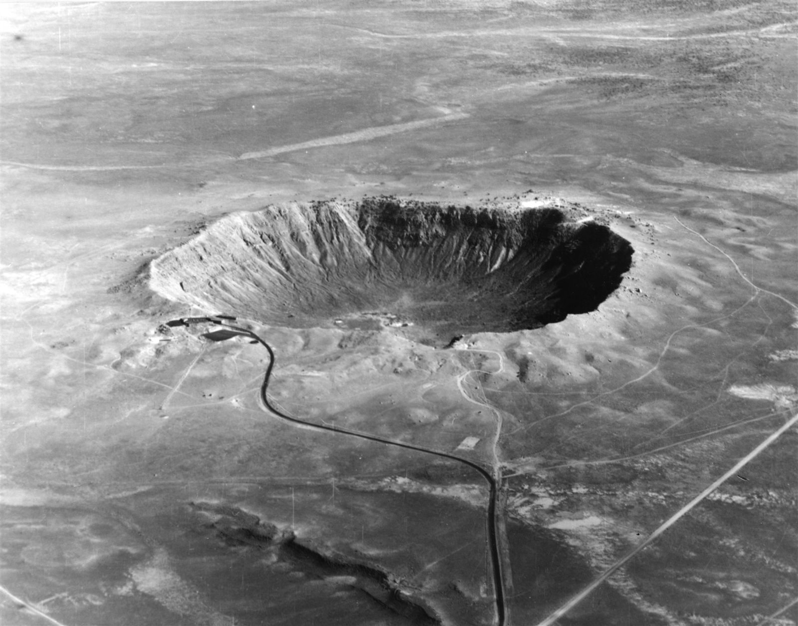 Aerial view of Meteor Crater, a bowl-shaped impact crater in northern Arizona.