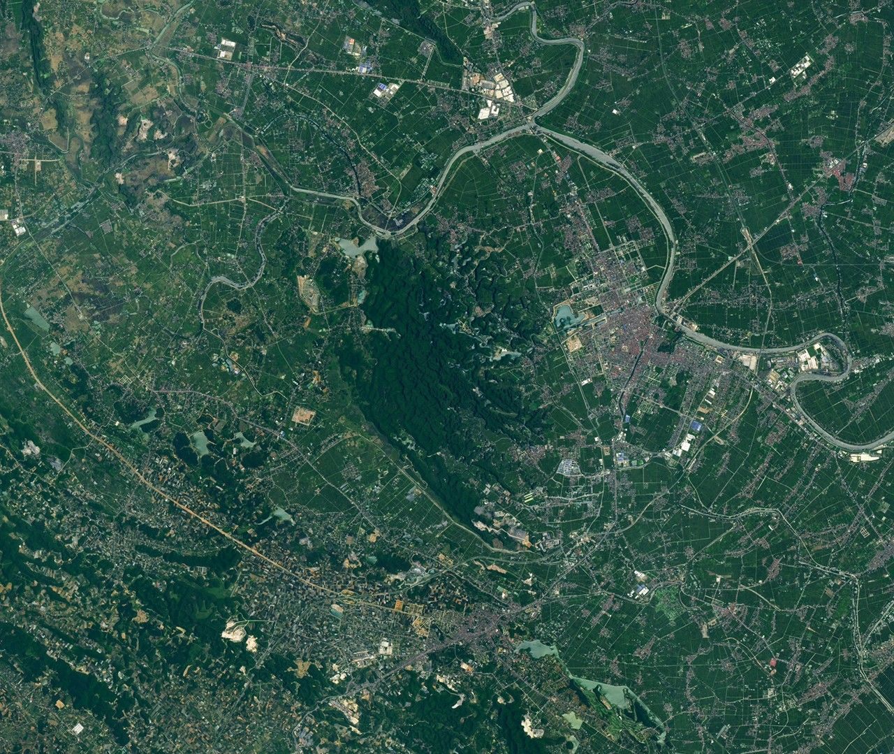 Satellite image of limestone karst towers in the Trang An landscape, Vietnam.
